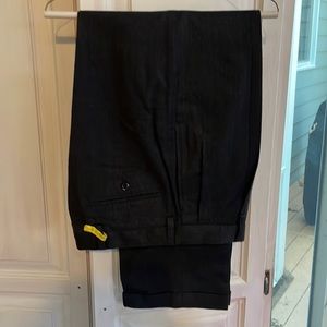 Men’s wool dress slacks with front pleats and cuffs